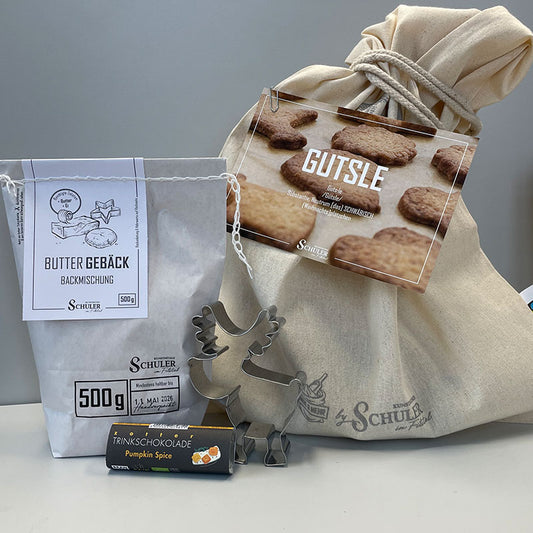 Brotbeutel aus Baumwolle, Backmischung Buttergebäck, Rudolf Ausstecher, weihnachtliche Postkarte und Trinkschokolade von Zotter ergeben unser Angebots Nikolaus Säckle.