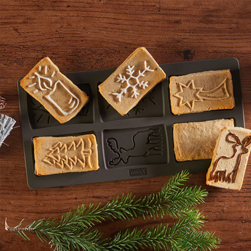 Spekulatius Flexiform von Lurch aus 100% Premium Silikon, in der Farbe braun. Die Form hat sechs weihnachtliche Motive, Beispiele von fertigen Spekulatius sind abgebildet, mit und ohne Glasur.